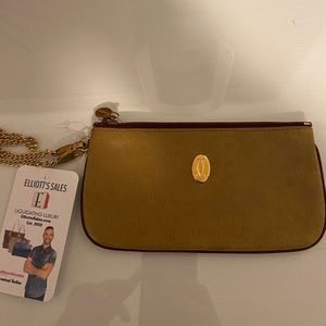 GUC Cartier wristlet in gold leather with gold-tone chain.